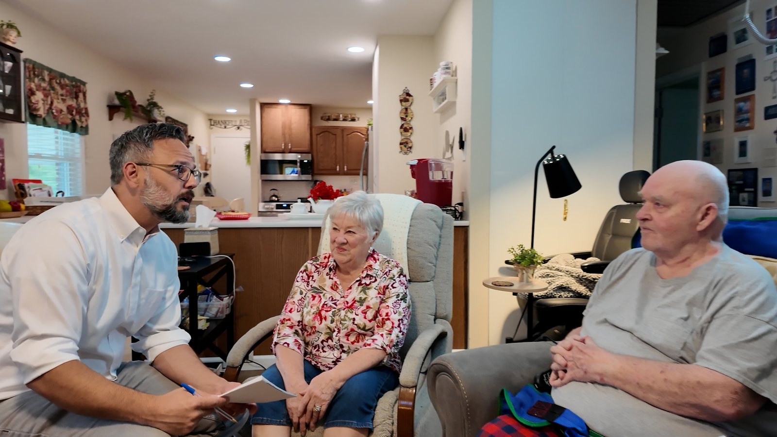 Phil Castaneda meeting with a family about their property