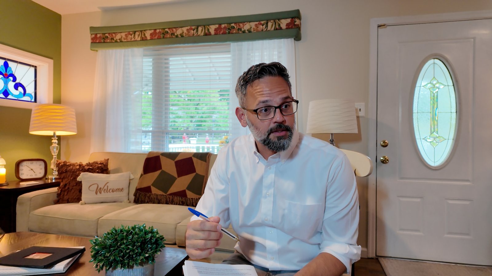 Phil Castaneda explaining the offer process to a homeowner